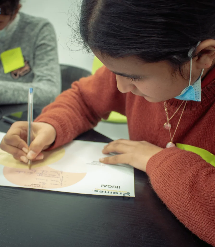 little girl writing on paper